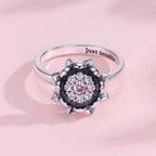 925 silver lotus anxiety ring with sparkling zircon stones and pink center stone — front view 